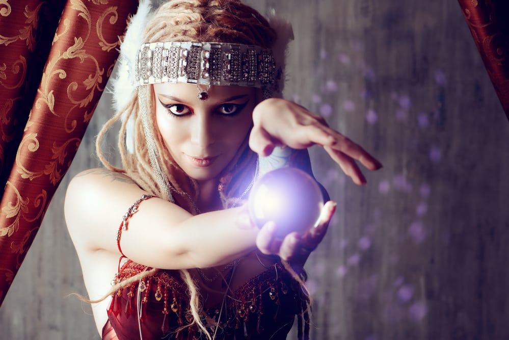 Magnificent fortune teller holding crystal ball. Divination. Magic. Halloween.