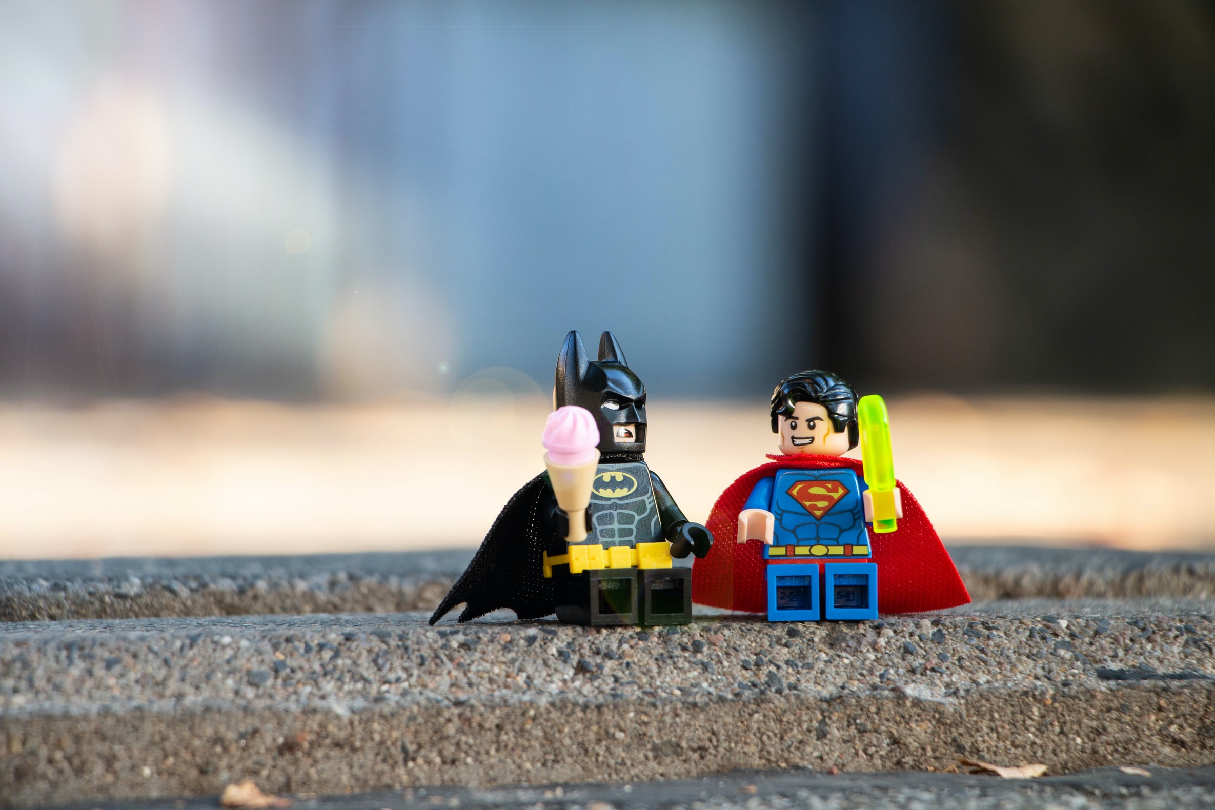 super man and batman discussing their next virtual team building event