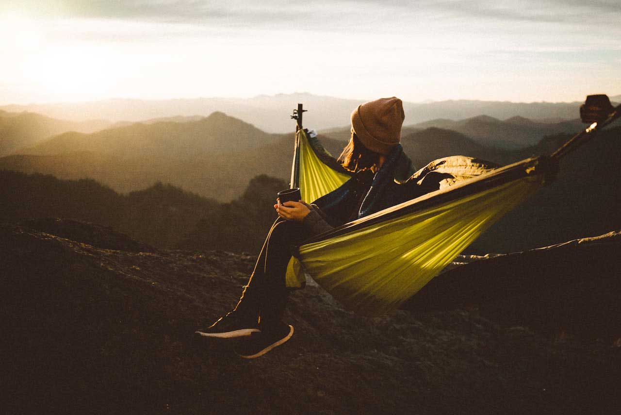 woman with an inspirational view from a hammock