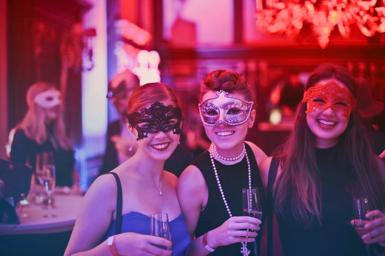 office party with 3 female colleague wearing masks