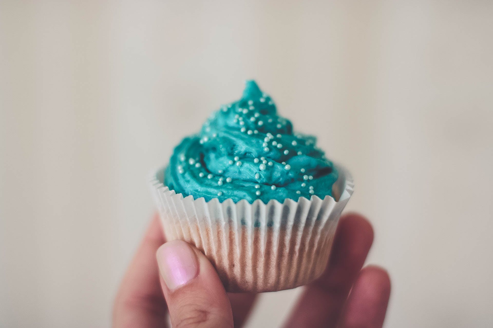 Vanilla cupcake with teal frosting