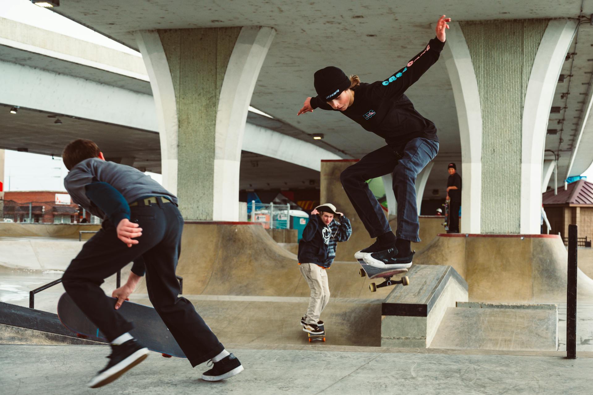 Three men skateboarding