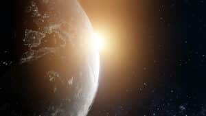 Earth with the sun behind it