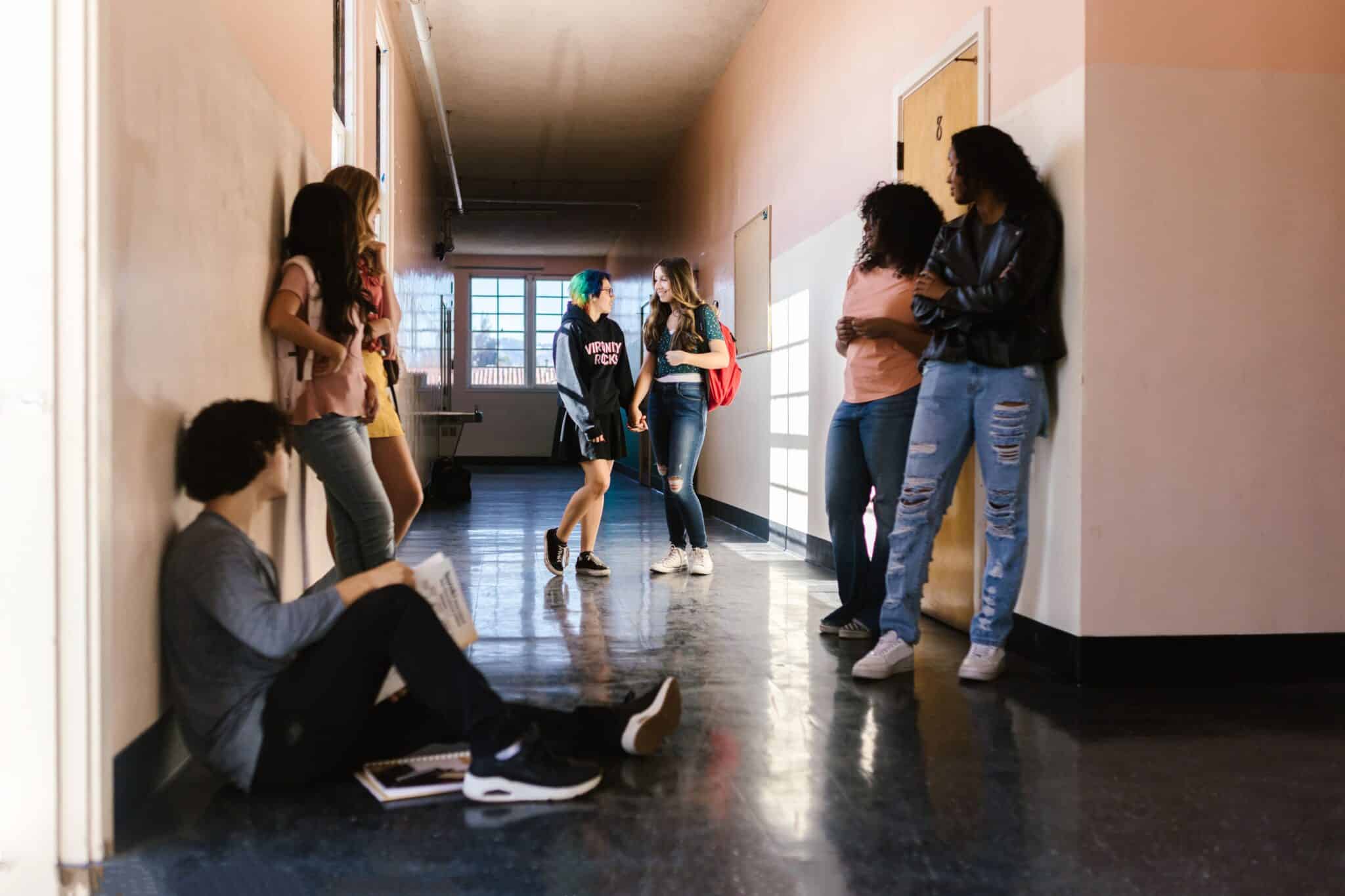 People standing in a university hallway
